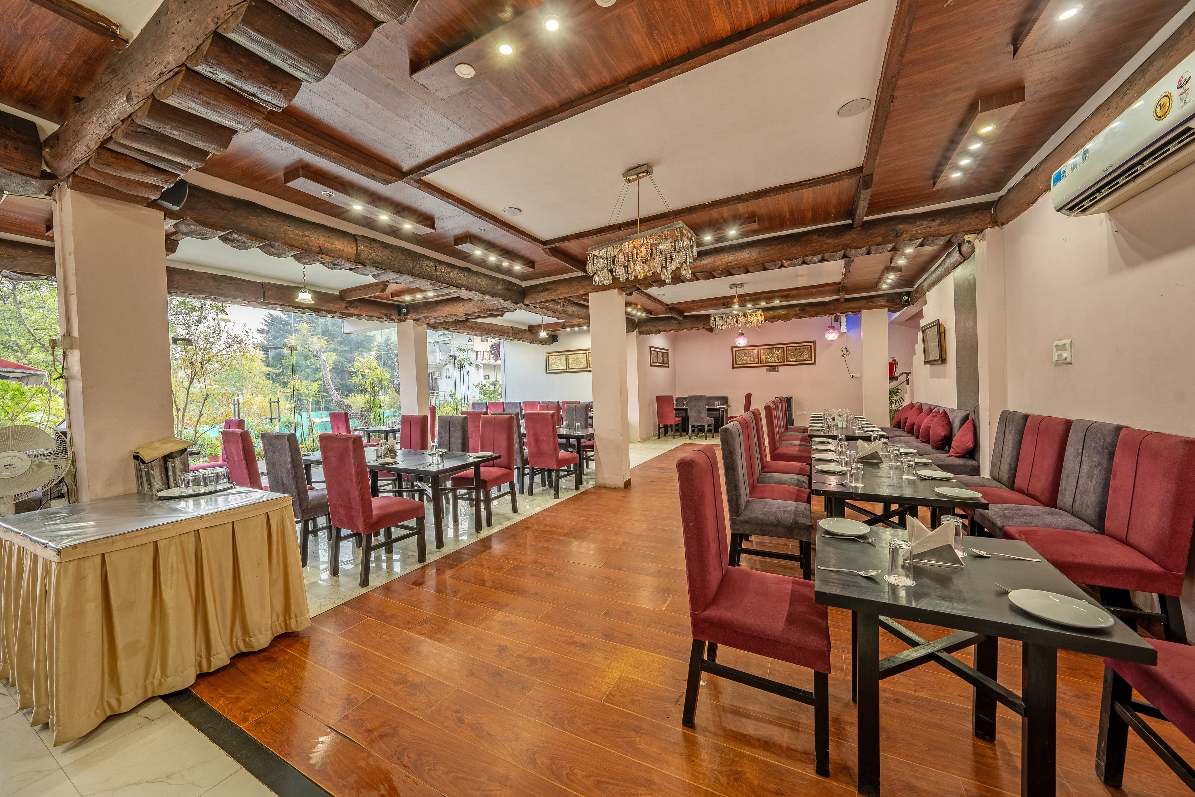 Restaurant dining room with buffet service at The Royal Court by Vikalp